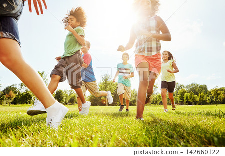 Happy children, playing and running with grass field in nature for fun, playful day or sunshine at park. Diversity or group of excited kids or youth enjoying sunny outdoor holiday or weekend together Happy children, playing and running with grass field in nature for fun, playful day or sunshine at park. Diversity or group of excited kids or youth enjoying sunny outdoor holiday or weekend together 142660122