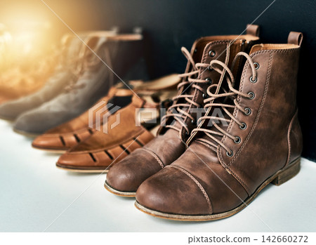 Shoes, pair and leather boots for fashion, choice and cool style or trendy. Footwear, sandals and designer loafer for customer, shopping and selection in elegant, classy and retail store with sale Shoes, pair and leather boots for fashion, choice and cool style or trendy. Footwear, sandals and designer loafer for customer, shopping and selection in elegant, classy and retail store with sale 142660272