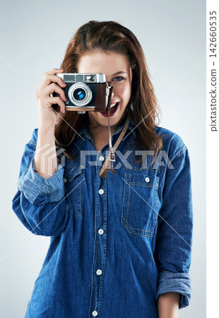 Woman, photographer and vintage camera in studio for newspaper, magazine and job at media company. Girl, paparazzi and retro tech for photoshoot, creativity and smile for story by white background Woman, photographer and vintage camera in studio for newspaper, magazine and job at media company. Girl, paparazzi and retro tech for photoshoot, creativity and smile for story by white background 142660535