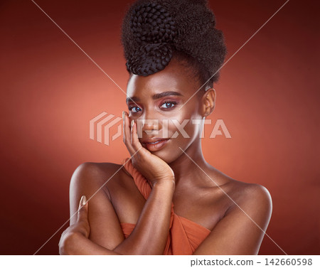 Portrait, black woman and beauty cosmetics for skincare, wellness and dermatology isolated on red studio background. Face, touch and makeup of serious African model for shine, glow and aesthetic 142660598