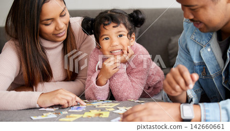 Parents, girl and happy in portrait with puzzle in home for learning, development and love with bonding. Father, mother and daughter for games, teaching and problem solving at family house in Bogota Parents, girl and happy in portrait with puzzle in home for learning, development and love with bonding. Father, mother and daughter for games, teaching and problem solving at family house in Bogota 142660661