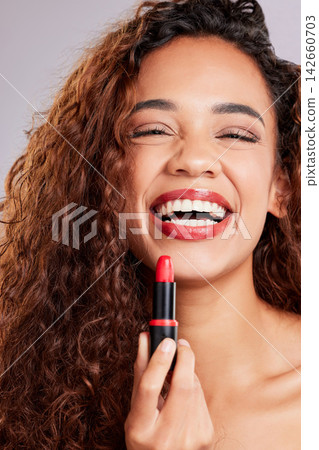 Woman, portrait and red lipstick product or happy for makeup cosmetics, confidence or grey background. Female person, face studio for beauty skin care or wellness facial for laughing, funny or joke 142660703