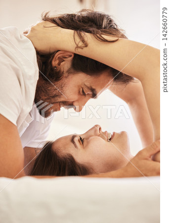 Love, couple and eye contact in bedroom in home for caring, bonding and romance together. Happy people, man and woman in relationship for dating or married, support and trust with commitment in house Love, couple and eye contact in bedroom in home for caring, bonding and romance together. Happy people, man and woman in relationship for dating or married, support and trust with commitment in house 142660779