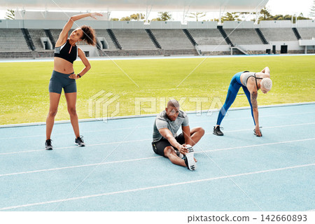 Exercise, running and stadium with team stretching on track at venue in preparation of competition or race. Fitness, training and warm up with athlete or runner people getting ready for event Exercise, running and stadium with team stretching on track at venue in preparation of competition or race. Fitness, training and warm up with athlete or runner people getting ready for event 142660893