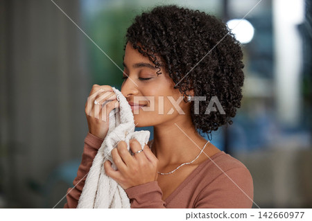 Clean, towel and woman with smelling in home for fresh aroma, maintenance and fragrance of fabric. Peace, smile and female person with cloth in house for linen, scent and happiness in spring cleaning Clean, towel and woman with smelling in home for fresh aroma, maintenance and fragrance of fabric. Peace, smile and female person with cloth in house for linen, scent and happiness in spring cleaning 142660977