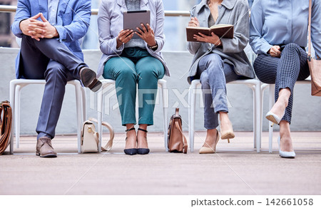 Business people, waiting room and interview for recruiting with career opportunity, writing and we are hiring. Queue, tablet and group sitting in office for hr meeting with job search and updating cv Business people, waiting room and interview for recruiting with career opportunity, writing and we are hiring. Queue, tablet and group sitting in office for hr meeting with job search and updating cv 142661058