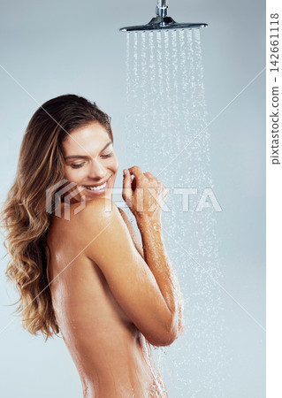 Hygiene, cleaning and woman with shower in studio for body care, skincare or wellness on white background. Water splash, smile and nude model for eyes closed, washing or happiness on mockup space Hygiene, cleaning and woman with shower in studio for body care, skincare or wellness on white background. Water splash, smile and nude model for eyes closed, washing or happiness on mockup space 142661118