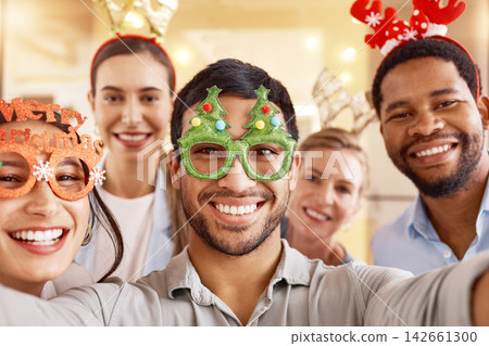 Christmas, portrait and selfie of happy team of business people together for diversity in office celebration. Face, xmas picture and group of friends at party, holiday or consultant at festive event Christmas, portrait and selfie of happy team of business people together for diversity in office celebration. Face, xmas picture and group of friends at party, holiday or consultant at festive event 142661300