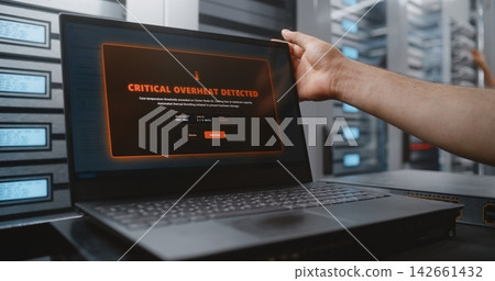 Male Network Engineer Managing Critical Server Overheating Incident with Network Switches and CLI Male Network Engineer Managing Critical Server Overheating Incident with Network Switches and CLI 142661432