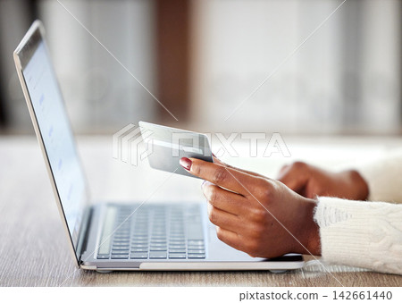 Credit card, ecommerce and laptop for purchase, hand and buying online. Computer, office and banking with fintech and shopping for female person in workplace, internet or digital payment at desk Credit card, ecommerce and laptop for purchase, hand and buying online. Computer, office and banking with fintech and shopping for female person in workplace, internet or digital payment at desk 142661440