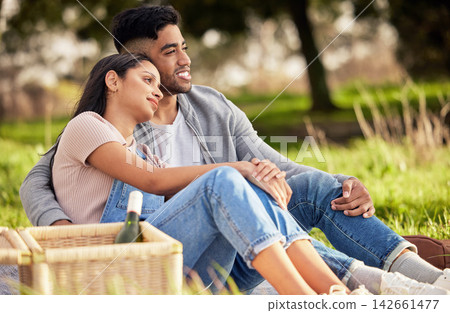Couple, picnic and basket on grass for love with celebrate anniversary, alcohol and together with relax. Woman, man and happiness in nature with smile, wine bottle and weekend date for relationship Couple, picnic and basket on grass for love with celebrate anniversary, alcohol and together with relax. Woman, man and happiness in nature with smile, wine bottle and weekend date for relationship 142661477
