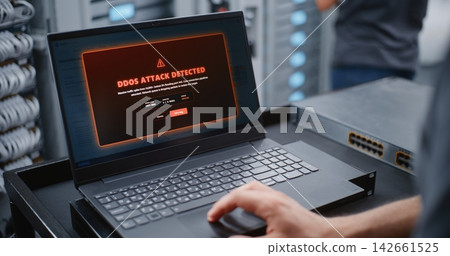 IT Engineer Responding to DDoS Attack Alert Through Linux CLI in Data Center IT Engineer Responding to DDoS Attack Alert Through Linux CLI in Data Center 142661525