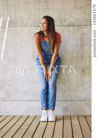 Fashion, woman and girl in city, thinking and happiness with fun, stylish clothes and gen z. Outdoor, person and casual outfit on wall background, ideas and decision with humor, laughing and cheerful Fashion, woman and girl in city, thinking and happiness with fun, stylish clothes and gen z. Outdoor, person and casual outfit on wall background, ideas and decision with humor, laughing and cheerful 142661579