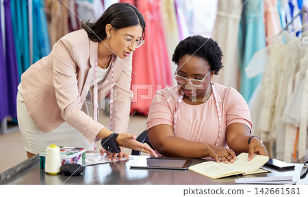 Small business, fashion designer and collaboration with tablet for check of sales, ecommerce and digital. Partnership, entrepreneur and women in boutique, planning and discussion of stock and profit Small business, fashion designer and collaboration with tablet for check of sales, ecommerce and digital. Partnership, entrepreneur and women in boutique, planning and discussion of stock and profit 142661581