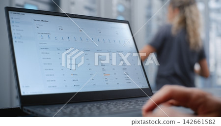 Male Network Engineer Monitoring Server Telemetry During Critical Overheating Incident Male Network Engineer Monitoring Server Telemetry During Critical Overheating Incident 142661582