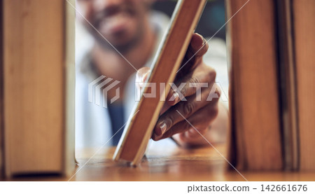 Person, hand and library bookshelf with choice for university learning or education, literature or study. College, campus and academic research for scholarship project or reading, knowledge or store Person, hand and library bookshelf with choice for university learning or education, literature or study. College, campus and academic research for scholarship project or reading, knowledge or store 142661676