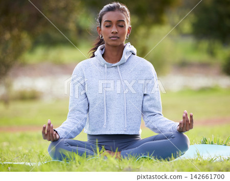 Yoga, meditation and Indian woman in park for wellness, healthy body and mindfulness in nature. Pilates, mental health and person in lotus pose for calm exercise, peace and spiritual awareness Yoga, meditation and Indian woman in park for wellness, healthy body and mindfulness in nature. Pilates, mental health and person in lotus pose for calm exercise, peace and spiritual awareness 142661700