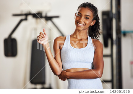 Portrait, thumbs up and woman in gym, fitness or exercise goals with wellness, proud of progress or challenge. Face, person or girl in health centre, hand gesture or symbol with like, workout or icon Portrait, thumbs up and woman in gym, fitness or exercise goals with wellness, proud of progress or challenge. Face, person or girl in health centre, hand gesture or symbol with like, workout or icon 142661936