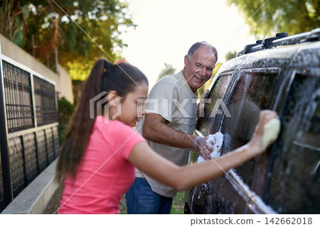 Father, child and car washing for cleaning, learning responsibility and development outdoor. Young girl, kid or teenager and dad for busy routine, childhood and cute for soapy water or fun on weekend Father, child and car washing for cleaning, learning responsibility and development outdoor. Young girl, kid or teenager and dad for busy routine, childhood and cute for soapy water or fun on weekend 142662018