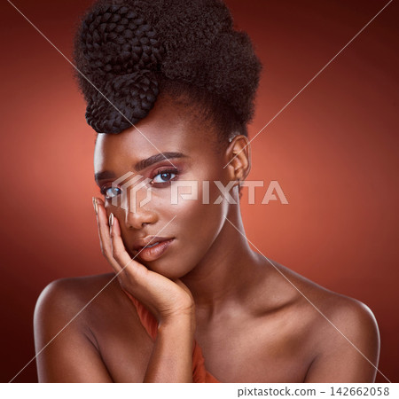 Portrait, beauty makeup and skincare of black woman in studio for wellness, dermatology or aesthetic isolated on red background. Face, touch and cosmetics of serious African model for shine or glow Portrait, beauty makeup and skincare of black woman in studio for wellness, dermatology or aesthetic isolated on red background. Face, touch and cosmetics of serious African model for shine or glow 142662058