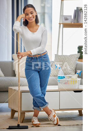 Woman, cleaning and portrait of cleaner in apartment working with broom, tools and happy to help. Maid, smile and hospitality service in hotel for maintenance of home and sweeping living room Woman, cleaning and portrait of cleaner in apartment working with broom, tools and happy to help. Maid, smile and hospitality service in hotel for maintenance of home and sweeping living room 142662126