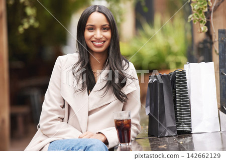 Happy, woman and break with drink from shopping to relax and rest at cafe on holiday or vacation. Female person, beverage and portrait with retail discount after promotion or sale for consumerism Happy, woman and break with drink from shopping to relax and rest at cafe on holiday or vacation. Female person, beverage and portrait with retail discount after promotion or sale for consumerism 142662129