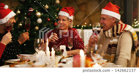 Christmas, dinner or happy family in home for food or eating on holiday together for bonding in social gathering. Man, woman or senior parents sharing feast with smile or wine to enjoy meal at night 142662137