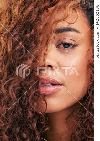 Woman, portrait and healthy haircare in studio, beauty and natural curls, texture and growth with balayage for transformation. Female hairdresser, salon and cosmetics for shine, results or glow Woman, portrait and healthy haircare in studio, beauty and natural curls, texture and growth with balayage for transformation. Female hairdresser, salon and cosmetics for shine, results or glow 142662138