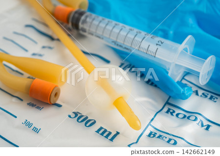Foley urinary catheter with urine bag for disability or patient in hospital. Foley urinary catheter with urine bag for disability or patient in hospital. 142662149