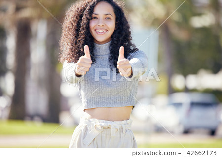 Portrait, thumbs up and woman in park, smile and sunshine with promotion, agreement and feedback. Face, outdoor and girl with hand gesture, summer and review with support, icon and like with sign Portrait, thumbs up and woman in park, smile and sunshine with promotion, agreement and feedback. Face, outdoor and girl with hand gesture, summer and review with support, icon and like with sign 142662173