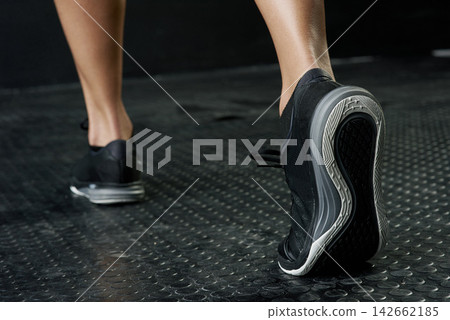 Fitness, foot and stretching with sports person in studio on dark background for start of workout. Exercise, warm up and wellness with back of athlete getting ready in health club for training Fitness, foot and stretching with sports person in studio on dark background for start of workout. Exercise, warm up and wellness with back of athlete getting ready in health club for training 142662185