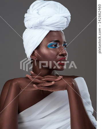 African, woman and creative makeup idea for art and pride in beauty of indigenous culture. Studio, model and thinking with color paint on skin with glow from cosmetics, skincare and traditional style African, woman and creative makeup idea for art and pride in beauty of indigenous culture. Studio, model and thinking with color paint on skin with glow from cosmetics, skincare and traditional style 142662460
