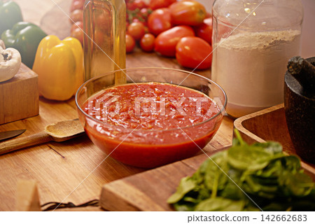 Cooking, food and sauce for pasta in kitchen for meal prep for dinner, supper and lunch in home. Recipe, diet and utensils on counter with ingredients, for wellness, nutrition and healthy eating Cooking, food and sauce for pasta in kitchen for meal prep for dinner, supper and lunch in home. Recipe, diet and utensils on counter with ingredients, for wellness, nutrition and healthy eating 142662683