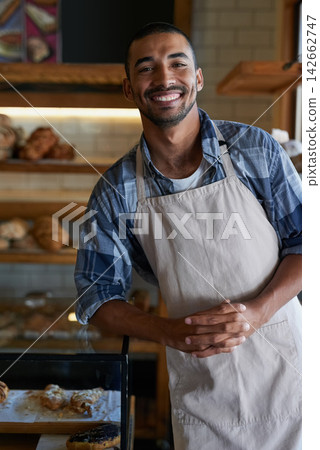 Bakery, cafe and male owner for business, portrait and smile for small scale restaurant and service. Kitchen, pastry and baker for entrepreneur in hospitality, shop and man for food industry startup Bakery, cafe and male owner for business, portrait and smile for small scale restaurant and service. Kitchen, pastry and baker for entrepreneur in hospitality, shop and man for food industry startup 142662747