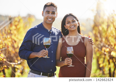 Couple, portrait and happy at vineyard with glass for wine tasting, hug and vacation in countryside. Man, woman and smile with drink, alcohol and date at farm in summer for holiday in California Couple, portrait and happy at vineyard with glass for wine tasting, hug and vacation in countryside. Man, woman and smile with drink, alcohol and date at farm in summer for holiday in California 142662824