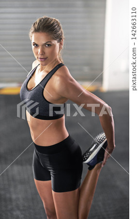 Portrait, exercise and woman stretching legs in gym for fitness, training and workout practice for healthy body wellness. Muscle, athlete and warm up for energy, sports and flexibility in Germany 142663110