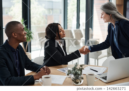 Office, handshake and business people with agreement for teamwork, partnership and networking. B2b, deal and professional employees with thank you, welcome and support in cooperation in workplace Office, handshake and business people with agreement for teamwork, partnership and networking. B2b, deal and professional employees with thank you, welcome and support in cooperation in workplace 142663271