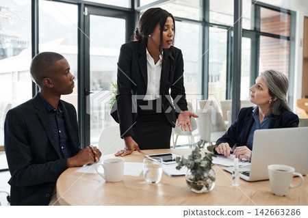 Financial advisor, woman or business people in presentation, meeting, conversation for teamwork in office. Discussion, talking or consultants planning strategy with feedback report or group project Financial advisor, woman or business people in presentation, meeting, conversation for teamwork in office. Discussion, talking or consultants planning strategy with feedback report or group project 142663286