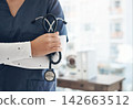 Woman, nurse and stethoscope in clinic office, healthcare and proud of medicine or insurance. Female person, tool and cardiology surgeon in hospital, heart specialist and medical physician intern 142663512
