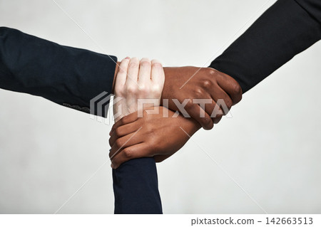 Studio, business people and hands together for support, teamwork and solidarity in workplace. White background, cooperation and company growth of corporate firm, networking and employees with trust Studio, business people and hands together for support, teamwork and solidarity in workplace. White background, cooperation and company growth of corporate firm, networking and employees with trust 142663513