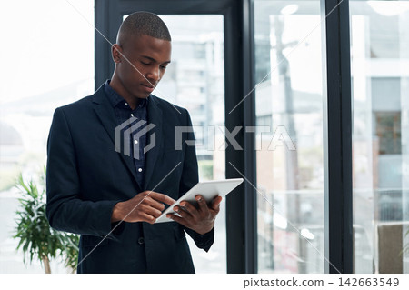 Online, lawyer and black man with tablet in office for legal research, app or advisor planning. Reading, news or professional attorney typing business email, networking or reminder to chat to contact Online, lawyer and black man with tablet in office for legal research, app or advisor planning. Reading, news or professional attorney typing business email, networking or reminder to chat to contact 142663549