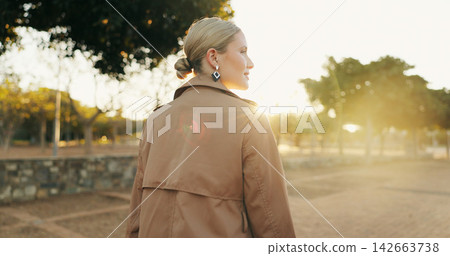 Outdoor, walking and back view of business woman for afternoon travel, journey and commute from workplace. Saleswoman, trees and daily movement after work, corporate and career for occupation Outdoor, walking and back view of business woman for afternoon travel, journey and commute from workplace. Saleswoman, trees and daily movement after work, corporate and career for occupation 142663738