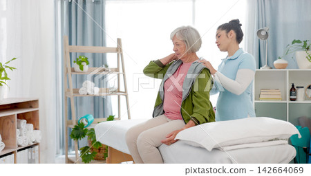 Physiotherapy, massage and senior woman consulting physiotherapist for injury, wellness and osteoporosis. Chiropractor, shoulders or old person with pain, service and rehabilitation with conversation Physiotherapy, massage and senior woman consulting physiotherapist for injury, wellness and osteoporosis. Chiropractor, shoulders or old person with pain, service and rehabilitation with conversation 142664069