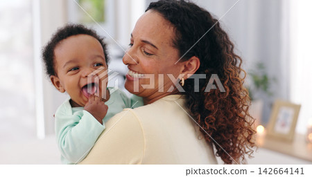 Love, hug and happy mother with baby in a house for bonding, play or support in their home together. Family, smile or mom laughing with kid at home for child development with safety, security or care 142664141