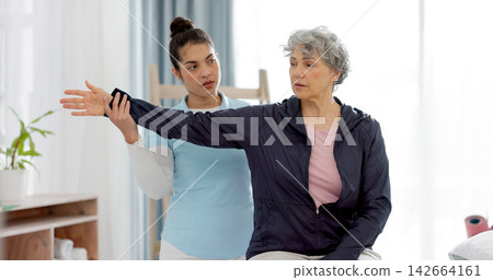 Physiotherapy, arm and senior woman consulting physiotherapist for injury, healthcare and osteoporosis. Chiropractor, stretch or old person with pain, shoulder and rehabilitation with medical problem Physiotherapy, arm and senior woman consulting physiotherapist for injury, healthcare and osteoporosis. Chiropractor, stretch or old person with pain, shoulder and rehabilitation with medical problem 142664161
