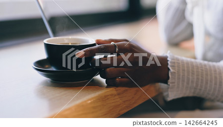Coffee shop, relax and hands of woman by window with drink for calm, wellness and breakfast in cafe. Restaurant, weekend and person with mug, aroma and scent for latte, caffeine and cappuccino 142664245
