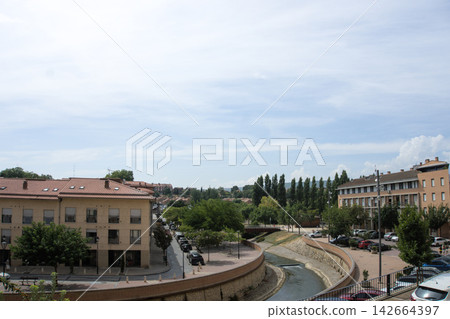 Channelled Queiles river running through Tarazona beside a riverside promenade Channelled Queiles river running through Tarazona beside a riverside promenade 142664397