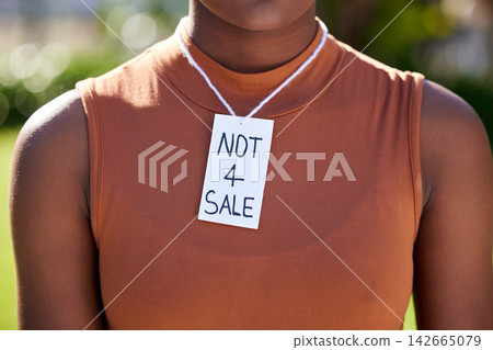 Woman, sign and activism outdoor with justice for human trafficking, gender equality fight and political opinion. African person, paper and protest in park for sexual slavery, freedom and empowerment 142665079