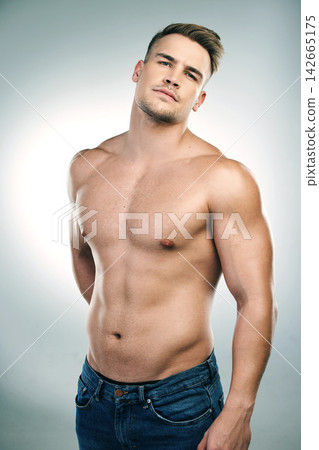 Portrait of man, abs and shirtless in studio with jeans for confidence, physical training or workout results on white background. Body, strong and model for bodybuilder, muscles or transformation Portrait of man, abs and shirtless in studio with jeans for confidence, physical training or workout results on white background. Body, strong and model for bodybuilder, muscles or transformation 142665175