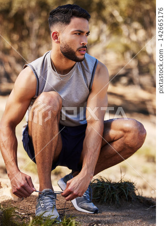 Man, runner and tying laces in outdoors, prepare and ready for workout or nature fitness. Male person, athlete and sneakers for jog or marathon training, gear and footwear for sports or wellness 142665176